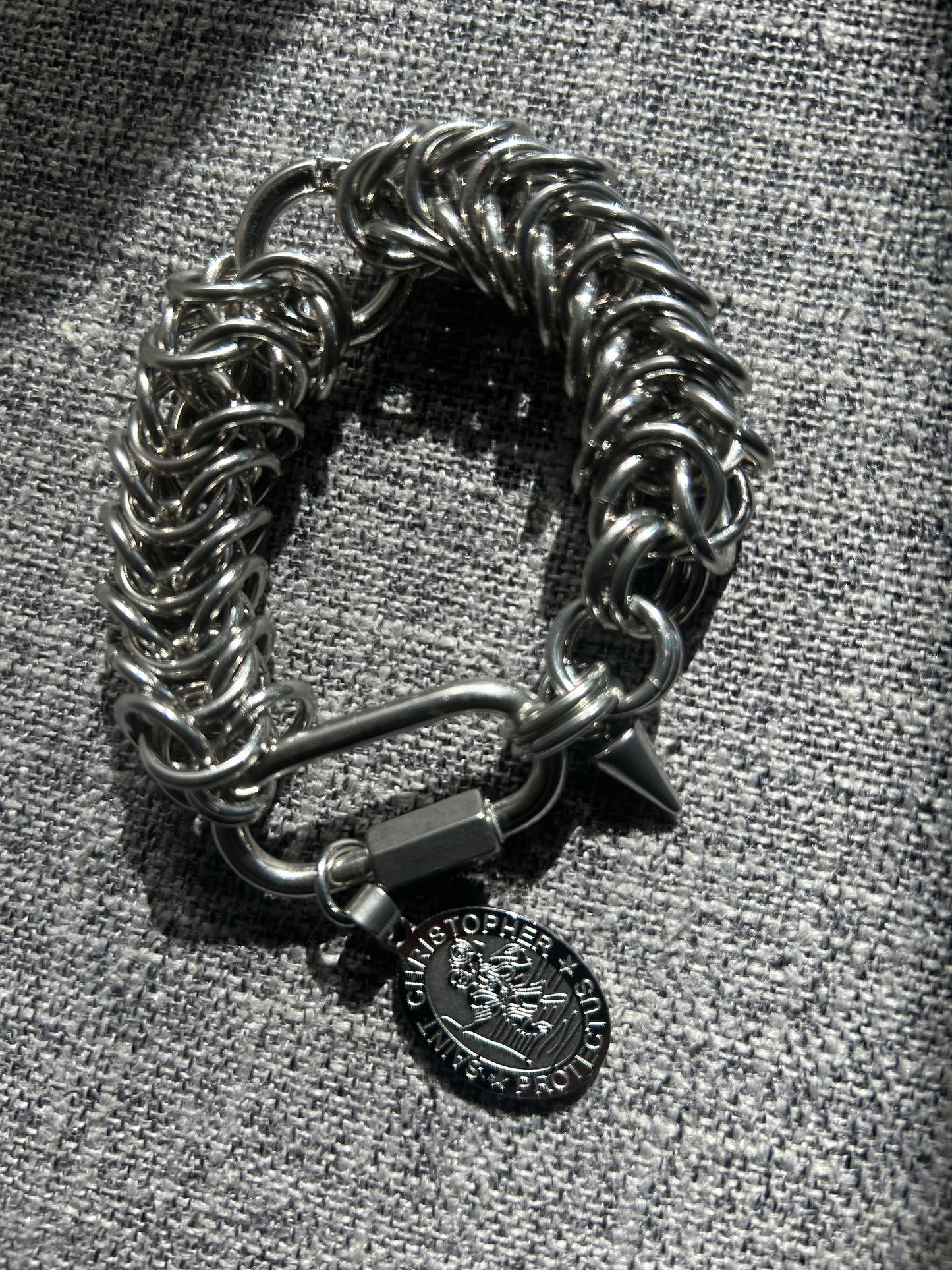 Chain-linked bracelet with St. Christopher charm