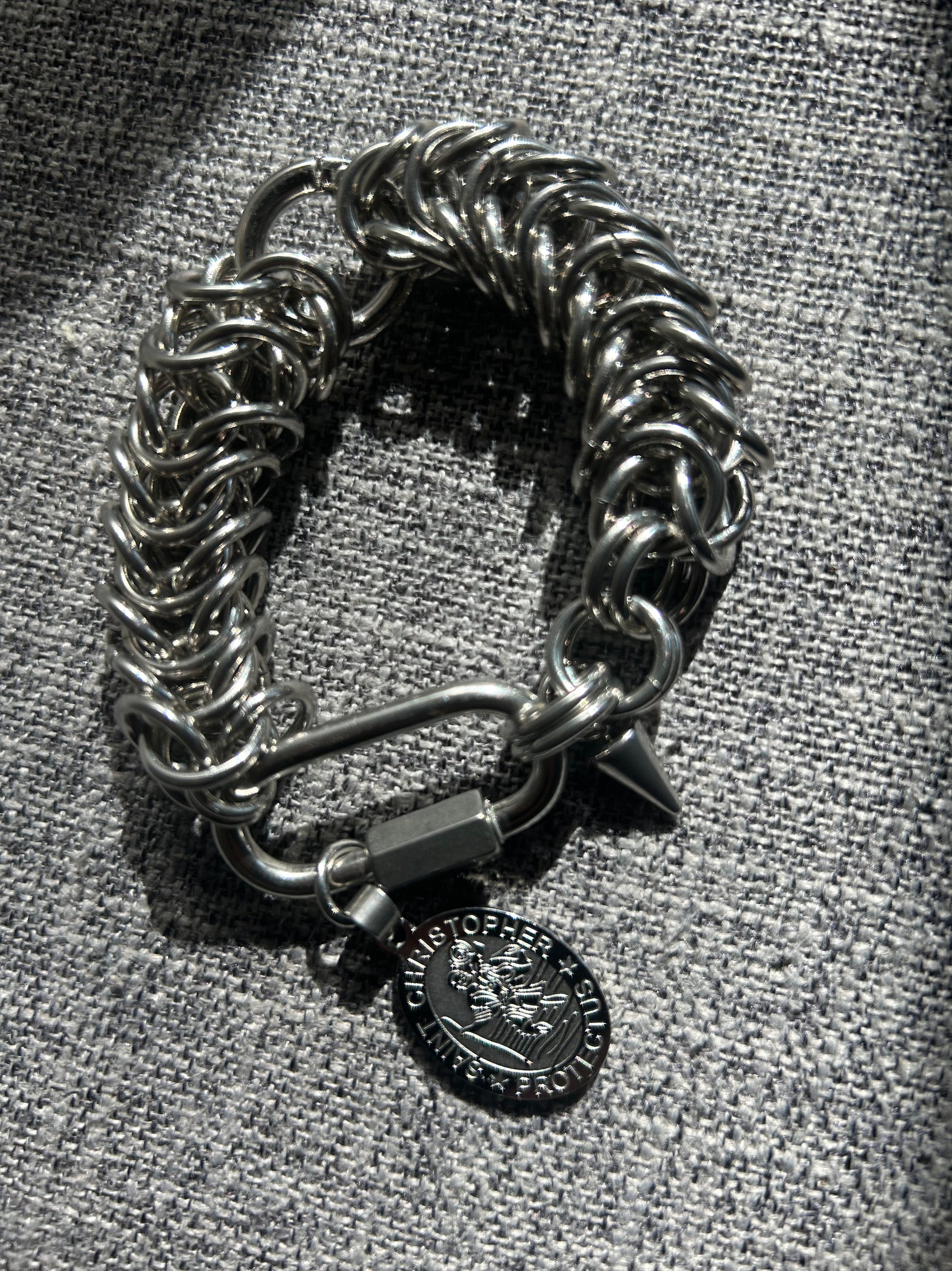 Chain-linked bracelet with St. Christopher charm